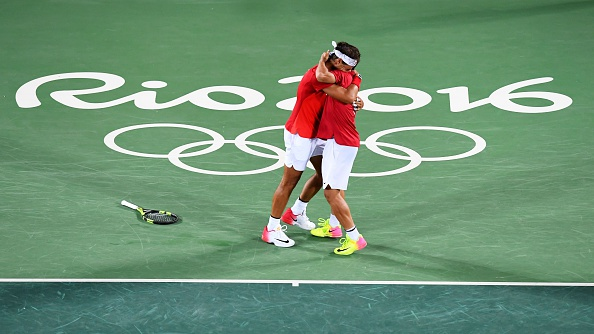 Spain's Rafael Nadal and Spain's Marc Lopez celebrate after winning the men's doubles final tennis match (Photo: Martin Bernetti/Getty Images)