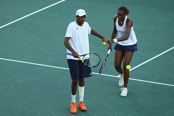 Rajeev Ram and Venus Williams celebrate winning a point (Photo: Clive Brunskill/Getty Images)