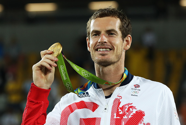 Andy Murray poses for pictures with his gold medal following his four set win over Juan Martin del Potro (Photo: Ian MacNicol/Getty Images)