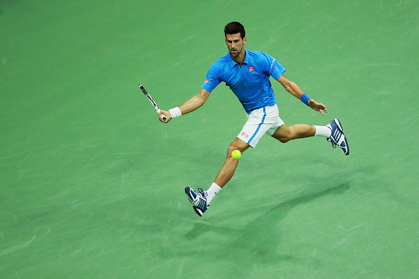 Novak Djokovic returns a shot to Jo-Wilfried TSonga (Photo: Michael Reaves/Getty Images)