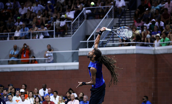Dustin Brown serves to Milos Raonic during the US Open (Photo: Michael Reaves/Getty Images)