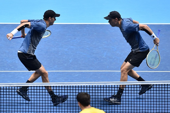 Bryan Brothers celebrate with traditional chest bump following victory (Photo: Glyn Kirk/Getty Images)