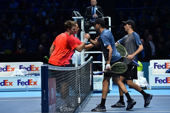 Henri Kontinen and John Peers are congratulated at the net by Bob Bryan and Mike Bryan (Photo: Glyn Kirk/Getty Images)