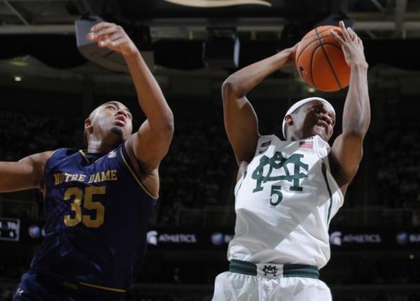 Michigan State's Cassius Winston grabs a rebound in front of Notre Dame's Bonzie Colson/Photo: Al Goldis/Associated Press