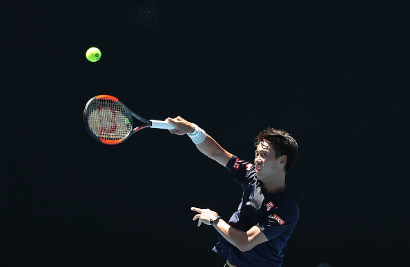 Kei Nishikori plays a smash shot in practice (Photo: Scott Barbour/Getty Images)