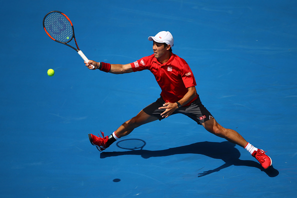 Kei Nishikori reaching for a shot (Photo: Clive Brunskill/Getty Images)