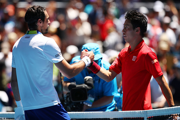 Kei Nishikori and Jeremy Chardy shake hands after the match (Photo: Clive Brunskill/Getty Images)