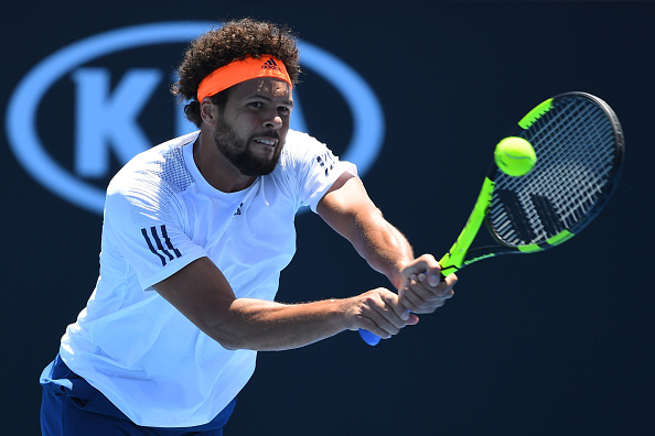 Jo-Wilfried Tsonga playing a bachand shot against Dusan Lajovic (Photo: Quinn Rooney/Getty Images)