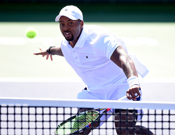 Donald Young his a volley (Photo: Harry How/Getty Images)