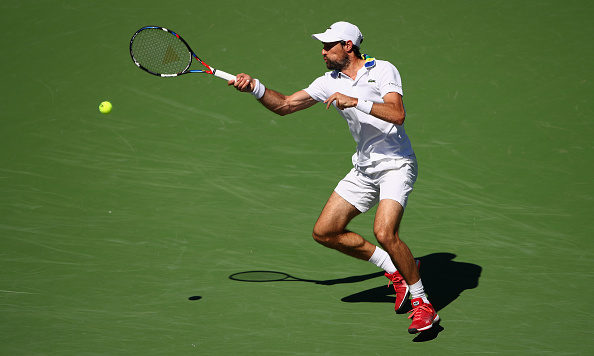 Jeremy Chardy hits a forehand shot (Photo: Clive Brunskill/Getty Images)