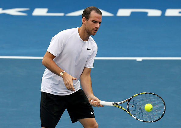 Adrian Mannarino plays a volley (Photo: Dave Rowland/Getty Images)