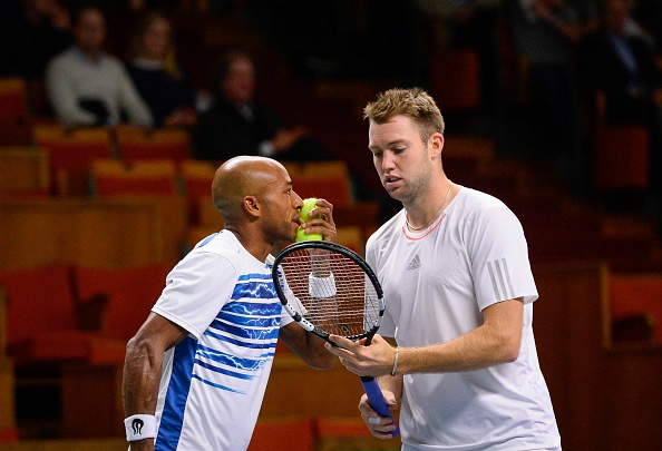 Nicholas Monroe and Jack Sock talk tactics in between points (Photo: Jonathan Nackstrand/Getty Images)