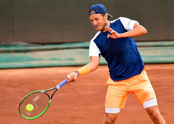 Lucas Pouille strikes a forehand shot (Photo: Attila Kisbenedek/Getty Images)