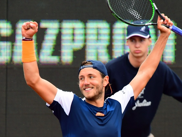 Lucas Pouille celebrates defeating Aljaz Bedene (Photo: Attila Kisbenedek/Getty Images)