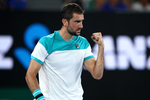 Marin Cilic celebrates after winning a point against Roger Federer during the 2018 Australian Open final. | Photo: Mark Kolbe/Getty Images