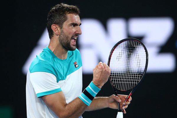 A pumped-up Marin Cilic celebrates after winning a point against Roger Federer during the 2018 Australian Open final. | Photo: Mark Kolbe/Getty Images