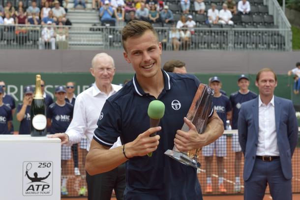 Marton Fucsovics holds the first trophy of his career after winning the Geneva Open. Photo: Geneva Open