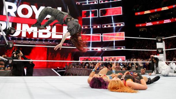 Lita execute her famous moonsault on Sasha Banks and Becky Lynch  Photo credit: WWE