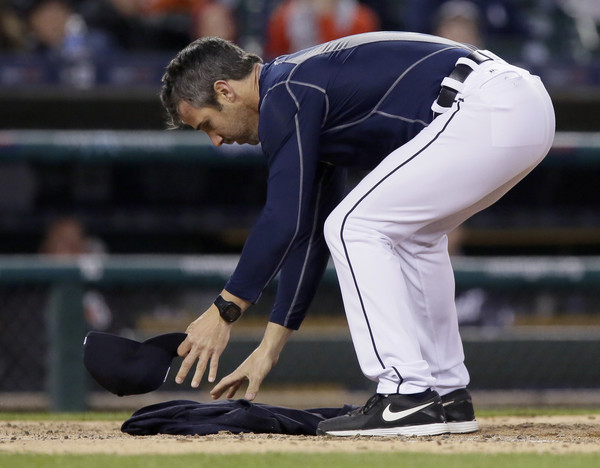 Manager Brad Ausmus #7 of the Detroit Tigers covers home plate with his jacket after being ejected for arguing when Nick Castellanos #9 of the Detroit Tigers was called out on strikes by home plate umpire Jeff Nelson in the fourth inning of a game against the Minnesota Twins at Comerica Park on May 16, 2016 in Detroit, Michigan. (May 15, 2016 - Source: Duane Burleson/Getty Images North America)