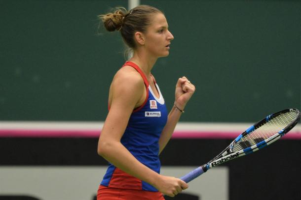 Karolina Pliskova fist pumps after winning a point | Photo: Martin Sidorjak/Fed Cup