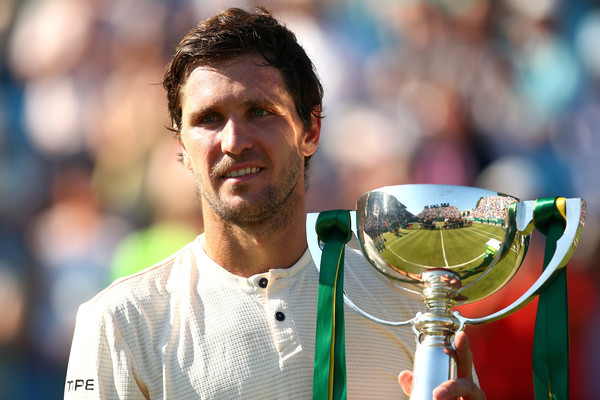 Mischa Zverev holds the first trophy of his career in Eastbourne. Photo: Getty Images