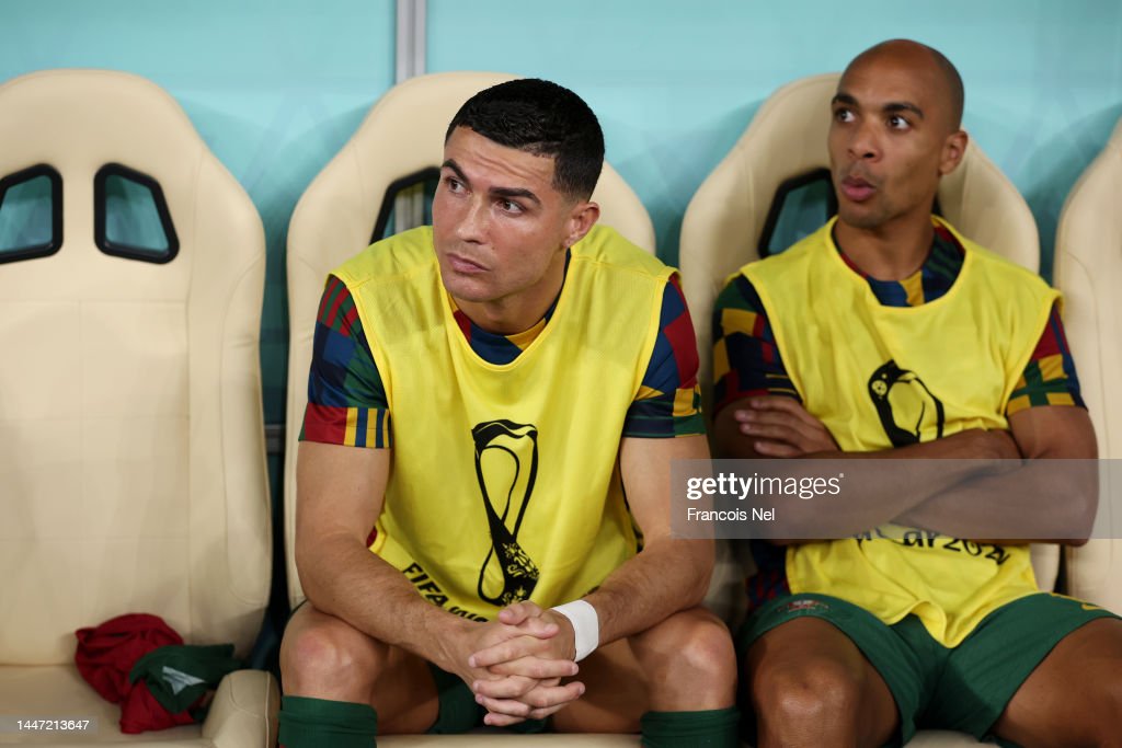 Cristiano Ronaldo of Portugal looks on from the bench prior to the FIFA World Cup Qatar 2022 Round of 16 match between Portugal and Switzerland at Lusail Stadium on December 06, 2022 in Lusail City, Qatar. (Photo by Francois Nel/Getty Images)