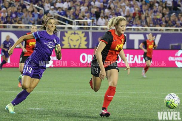 Alex Morgan (left) chases after Abby Dahlkemper during a game in 2016 | Source: Bernie Walls - VAVEL USA