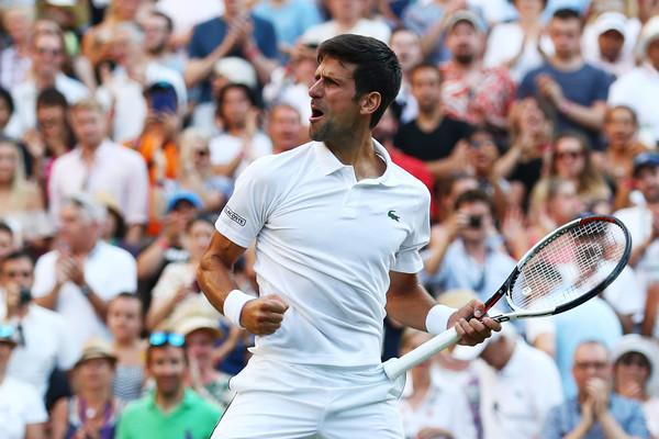 Novak Djokovic celebrates his victory over Kyle Edmund in the third round of Wimbledon. Photo: Matthew Lewis/Getty Images