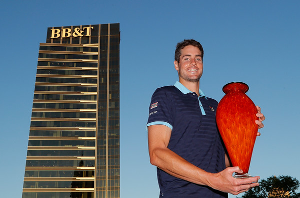 John Isner poses with the trophy after winning his fourth Atlanta title last summer. Photo: Kevin C. Cox/Getty Images