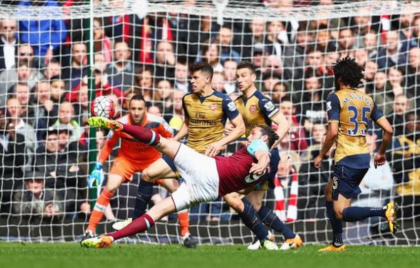 Carroll scoring the second of his three goals against