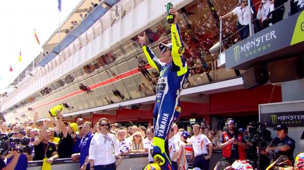 Rossi celebrating his win after battle with Marquez - www.motogp.com