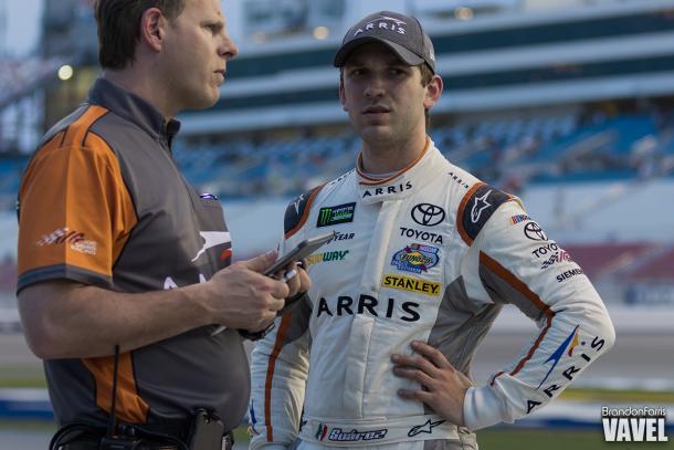 Daniel Suarez consults with his crew chief.