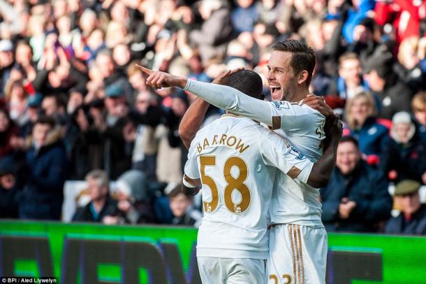 Super sub Barrow celebrates with goal-scorer Sigurdsson. | Photo: BPI