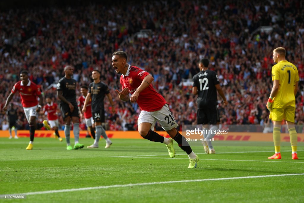 Antony of Manchester United celebrates after scoring their sides first goal during the Premier League match between Manchester United and Arsenal FC at Old Trafford on September 04, 2022 in Manchester, England. (Photo by Shaun Botterill/Getty Images)