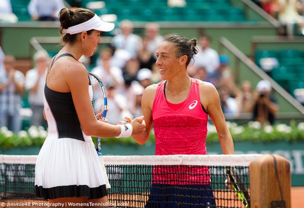 Garbiñe Muguruza and Francesca Schiavone meet at the net after their first-round clash at the 2017 French Open. | Photo: Jimmie48 Tennis Photography