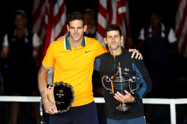 Del Potro (left) and Djokovic embrace with their trophies after the US Open final. Photo: Julian Finney/Getty Images