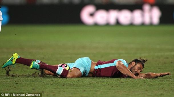 Above: Andy Carroll lying on the pitch after picking up an injury in West Ham's 1-1 draw with Astra Giurgiu | Photo: BPI/Michael Zemanek