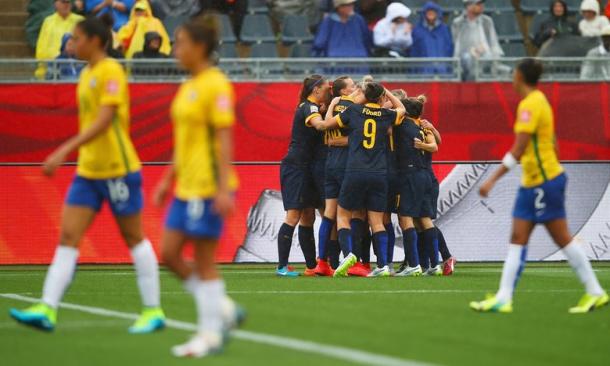 Australia celebrate their slender win over Brazil at last summer's World Cup. (Photo: Clive Rose/FIFA via Getty Images)