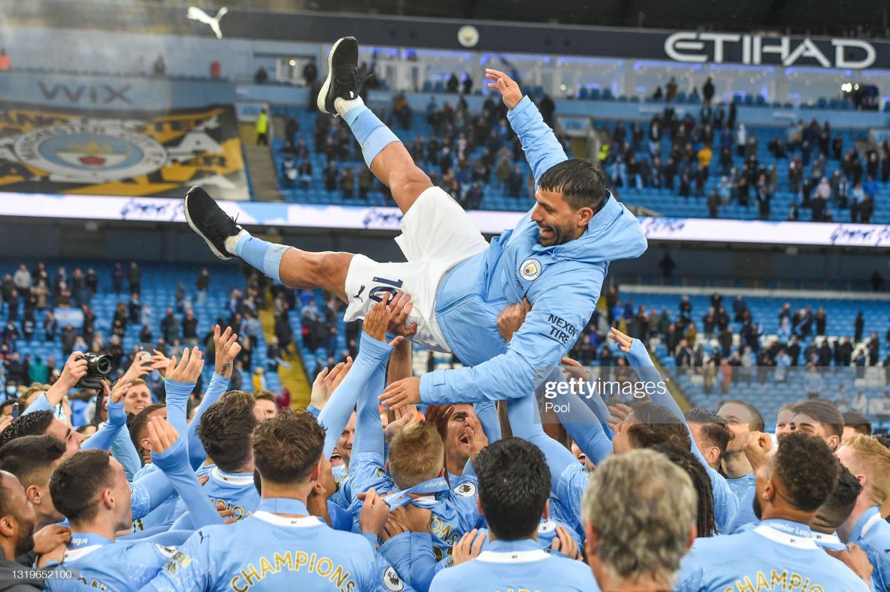 Sergio Aguero of Manchester City is thrown into the air by his teammates after playing his last game for Manchester City following the Premier League match between Manchester City and Everton at Etihad Stadium on May 23, 2021 in Manchester, England. A limited number of fans will be allowed into Premier League stadiums as Coronavirus restrictions begin to ease in the UK. (Photo by Peter Powell - Pool/Getty Images)