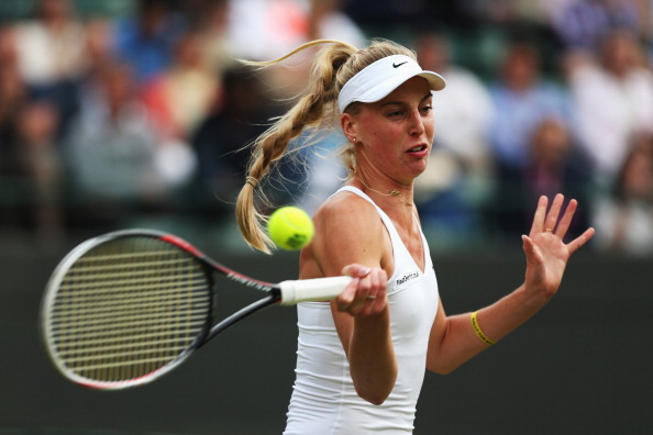 Naomi Broady hits a forehand at The Championships Wimbledon 2014/Getty Images