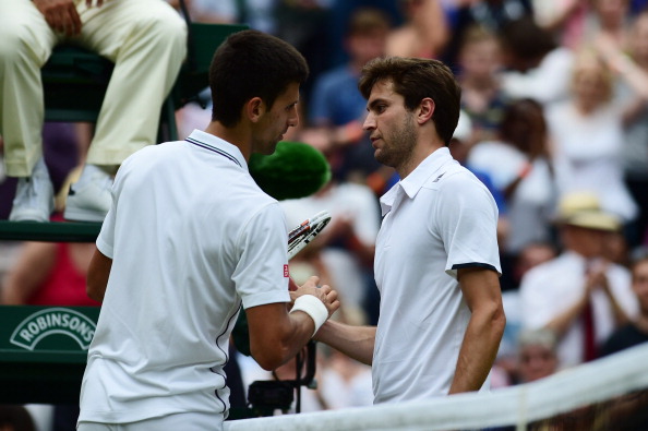 Djokovic and Simon (right) after their 2014 Wimbledon match (Photo: Getty Images)