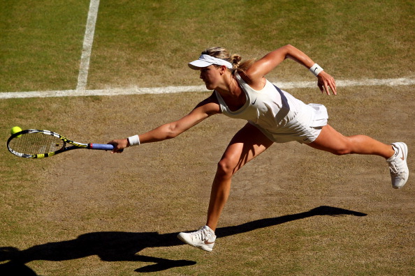 Eugenie Bouchard in action at Wimbledon 2014 (Photo by Clive Brunskill/Getty Images)