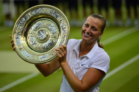 Kvitova poses with the Venus Rosewater Dish after the conclusion of the 2014 Wimbledon final. Photo credit: Carl Court/Getty Images.