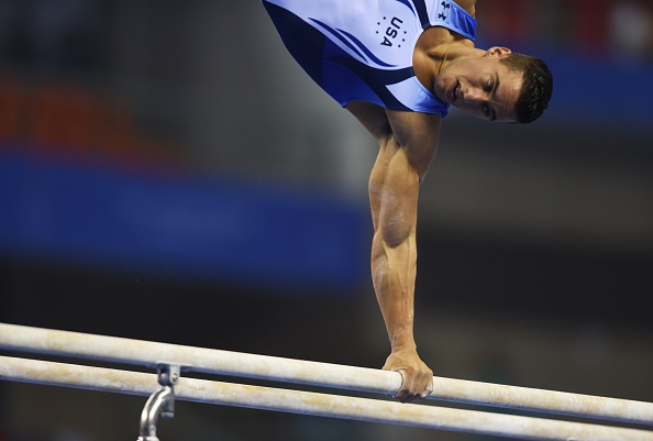 Jake Dalton performs on parallel bars at the 2014 World Artistic Gymnastics Championships/Getty Images
