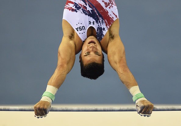 Jake Dalton performing on the high bar at the 2014 World Artistic Gymnastics Championships/Getty Images