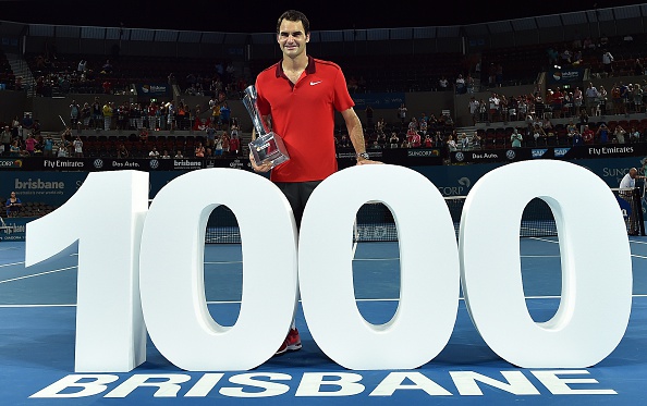 Federer celebrates his 1000th career victory in Brisbane last season after defeating Milos Raonic in the finals. Credit: Saeed Khan/Getty Images
