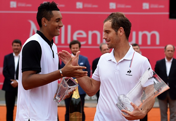 French tennis player Richard Gasquet (R) shakes hands with Australian tennis player Nick Kyrgios on the podium of the final of the Estoril Open Tennis tournament, in Estoril on May 3, 2015. Gasquet won 6-3, 6-3 and 6-2. AFP PHOTO/ FRANCISCO LEONG (Photo credit should read FRANCISCO LEONG/AFP/Getty Images)