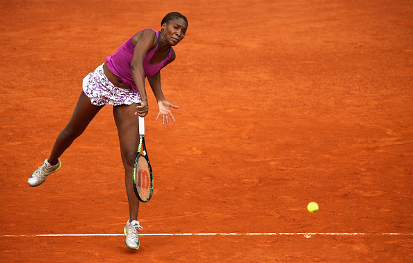 Venus Williams serves at the 2015 Mutua Madrid Open/Getty Images