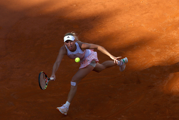 Caroline Wozniacki runs down a forehand at the Internazionali BNL D'Italia in Rome/Getty Images