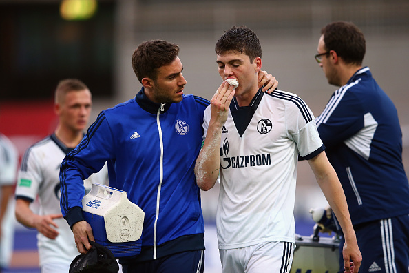 Jacob Rasmussen of Schalke receives treatment during the A Juniors Bundesliga Semi Final match between U19 Karlsruher SC and U19 FC Schalke 04 at Wildparkstadion on May 13, 2015 in Karlsruhe, Germany. (Photo by Alex Grimm/Bongarts/Getty Images)